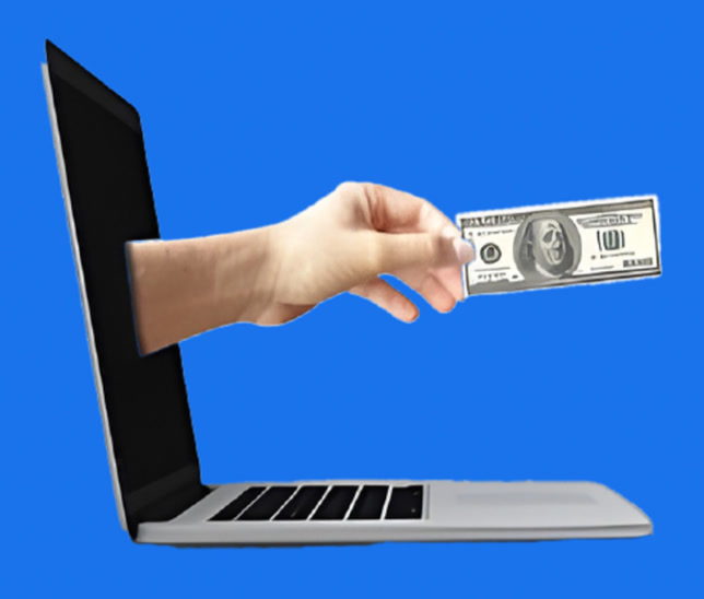 Hand reaching out of a laptop holding cash