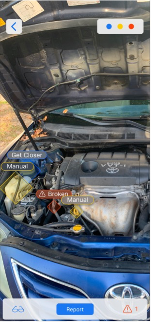 AR inspection overlay on a car engine with broken and manual markers